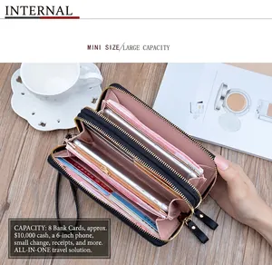 Detalle de billetera con doble cremallera y compartimentos para tarjetas y móvil