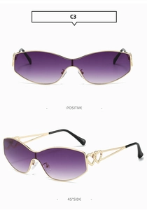 Détail de lunettes de soleil dégradées violettes avec monture dorée à double cœur évidé