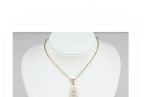 Macro shot of 18k gold plated titanium steel letter A pendant with sparkling diamonds
