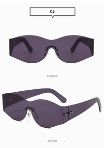 Detail view of Y2K rimless curved shield sunglasses in deep purple with sleek lens cut