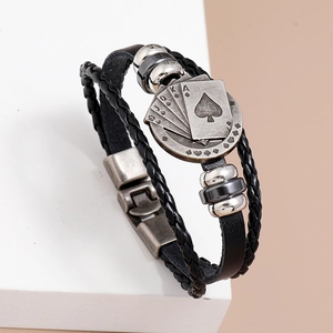 Mens braided leather bracelet with vintage alloy poker cards design on a white pedestal