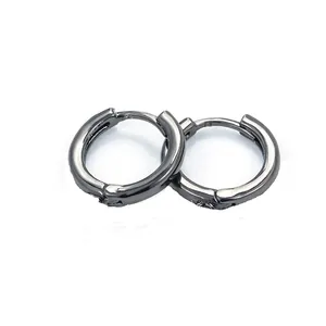 Detailed view of gunmetal huggie earrings with a sleek polished finish on white background