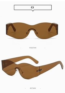 Close-up of brown frameless curved sunglasses with unique wavy lens edge design