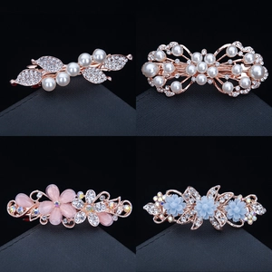 Elegant assortment of rhinestone and pearl bow barrettes in various floral styles