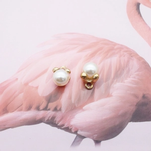 DIY jewelry parts featuring elegant white pearls set in golden alloy metal frames
