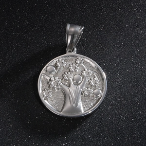 Polished stainless steel Tree of Life pendant necklace for men on dark background