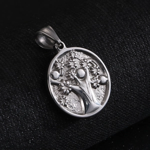 Detail of polished stainless steel Tree of Life pendant with embossed 3D texture and matte finish