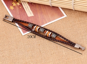 Detail of 20cm multi-layer brown braided leather bracelet with wood and metal beads