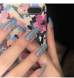 Macro shot of grey-blue aurora coffin press-on nails with iridescent mirror finish