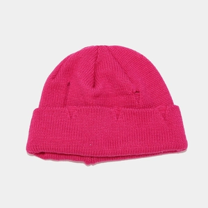 Detail of rose red distressed beanie with unique ripped holes and chunky knit texture