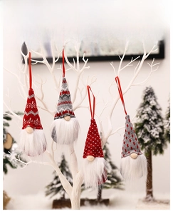 Set of 4 Christmas gnomes with red and grey knitted hats hanging on a decorative white branch