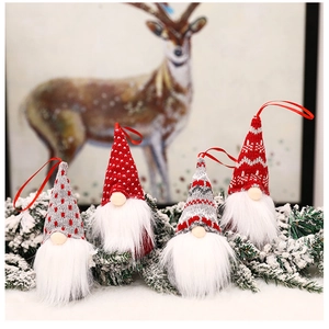 Detail of 4-piece faceless Santa doll hanging ornaments on pine branches for Christmas decor