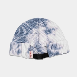 Blue and white tie-dye knit docker cap with adjustable back strap and buckle