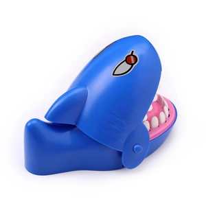 Detailed view of the blue cartoon shark biting toy with white teeth and internal mechanism