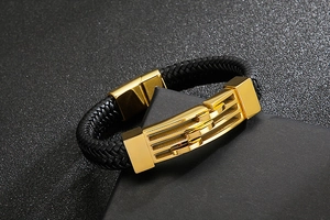 Detailed close-up of men's braided leather bracelet with a gold stainless steel magnetic clasp