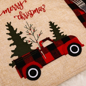 Burlap Christmas placemat with red plaid car and tree embroidery featuring Merry Christmas text