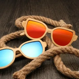 Close-up of bamboo wood sunglasses with blue and orange reflective polarized lenses