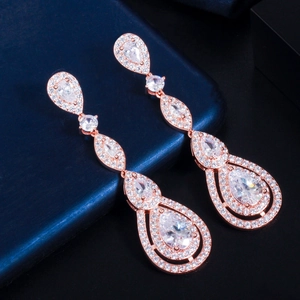 Detailed macro shot of rose gold waterdrop earrings with AAA cubic zirconia inlays