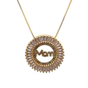 Detailed close-up of golden MOM necklace pendant with colorful micro-pave crystals