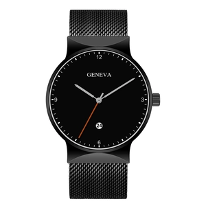 Detail of minimalist black quartz watch face with orange second hand and date window