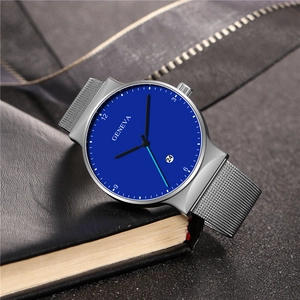 Detailed close-up of blue quartz watch dial with silver mesh strap on leather texture