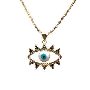 Detailed view of evil eye pendant with colorful zircons and gold box chain