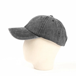 Detailed side view of dark grey washed cotton baseball cap on a display head stand