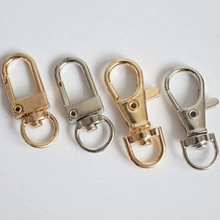 Detail view of gold and silver heart-shaped alloy lobster clasps for DIY jewelry making