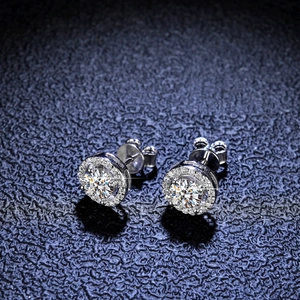 Macro shot of S925 silver halo stud earring with brilliant round-cut moissanite stone