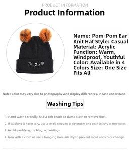 Detail view of pom-pom ear knit hat with cat embroidery and care instructions