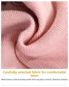 Detailed macro view of soft pink knitted fabric texture showing fine weave patterns
