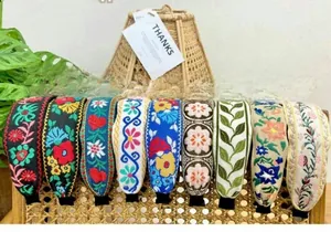 Selection of nine boho style embroidered wide headbands with diverse floral and geometric patterns