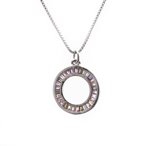 Macro shot of silver necklace featuring a round pendant with multi-color rectangular crystals
