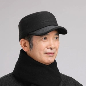 Detail of classic black flat top winter hat for men with ear protection and sturdy brim