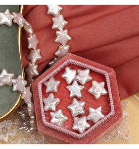 Macro shot of star-shaped baroque freshwater pearls with pink luster for DIY jewelry making