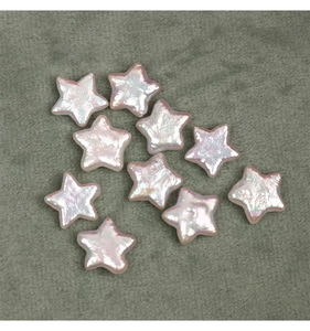 Macro detail of star-shaped baroque pearls with pink iridescent luster for jewelry DIY