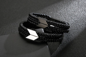 Detail of double-layer braided leather bracelets with stainless steel arrow magnetic clasps