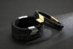 Detail of woven leather bracelets with magnetic stainless steel arrow clasps in three finishes