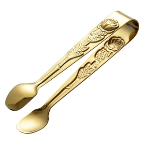 Golden 304 stainless steel sugar tongs with elegant rose floral relief on white background