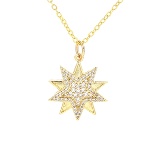 Macro shot of gold octagonal star pendant with pavé set cubic zirconia on O-chain