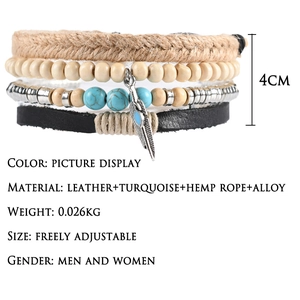 Multilayer leather bracelet with turquoise and feather charms on a white background