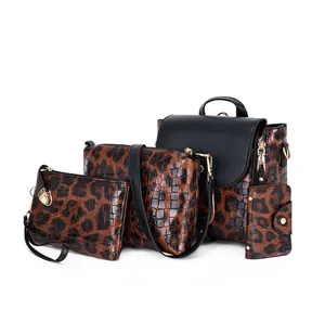 Detailed four-piece leopard print bag set with backpack, crossbody, clutch and card holder