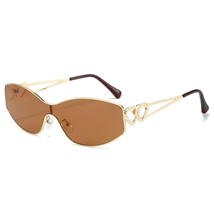 Lunettes de soleil oversize marron avec monture en métal doré et détails cœurs