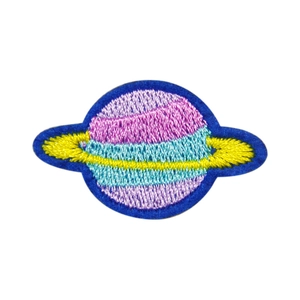 Space-themed embroidered planet patch with pink and purple thread and dark blue edge