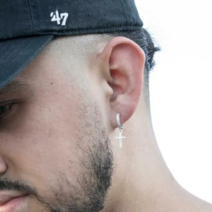 Mens silver cross hoop earrings with white zircon stones in trendy hip-hop style on model