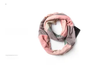 Detail of soft plaid scarf with pink and grey color blocking and functional zipper pocket