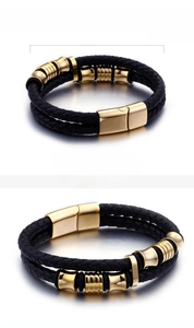 Detailed view of black braided leather bracelet with gold stainless steel magnetic clasp