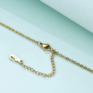 Macro detail of 18K gold plated lobster clasp and adjustable link chain on necklace