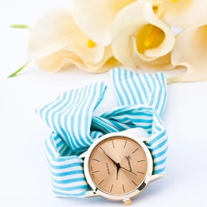 Geneva women's rose gold watch with blue and white striped fabric ribbon bow strap