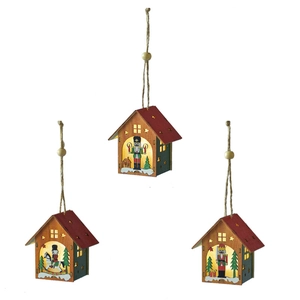 Three glowing wooden Christmas house ornaments with nutcracker designs and LED lights